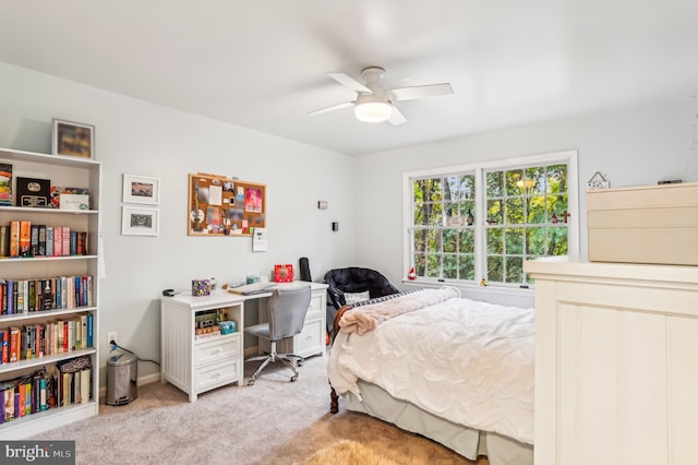 bedroom featuring light colored carpet and ceiling fan