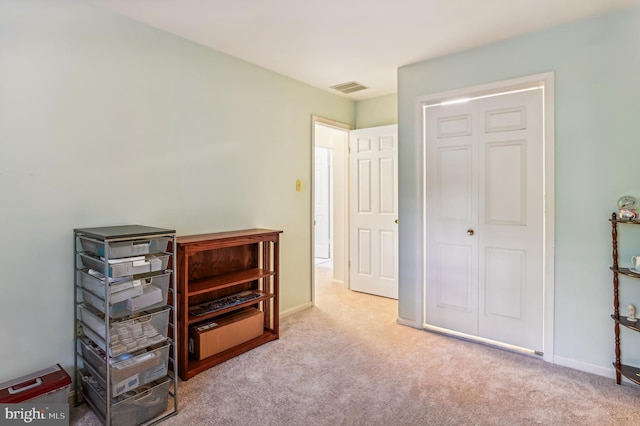 carpeted bedroom with a closet