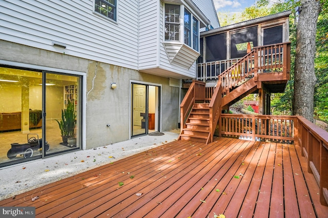 wooden deck featuring a sunroom