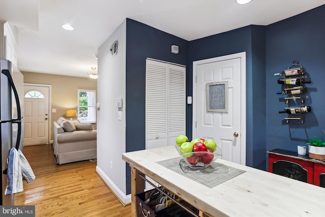 dining space with light hardwood / wood-style floors