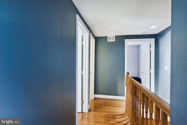 corridor featuring light hardwood / wood-style floors