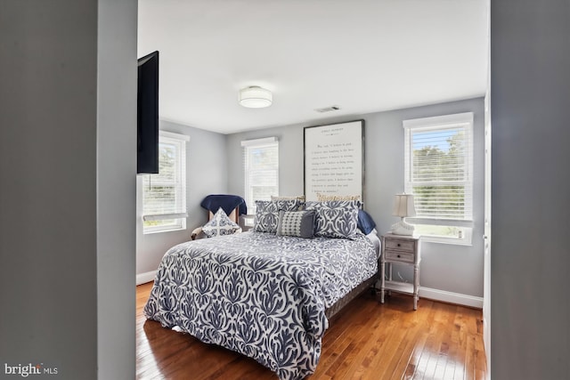 bedroom with wood-type flooring