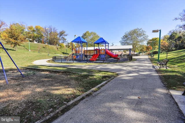 view of play area featuring a lawn