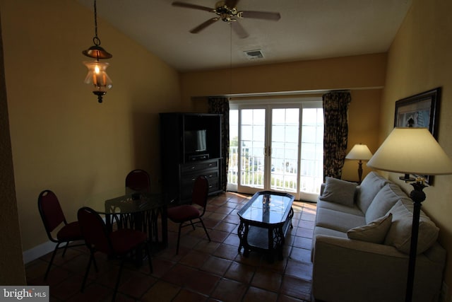 tiled living room featuring lofted ceiling and ceiling fan