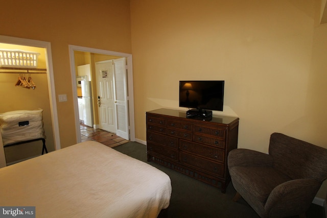 bedroom featuring hardwood / wood-style flooring and a closet