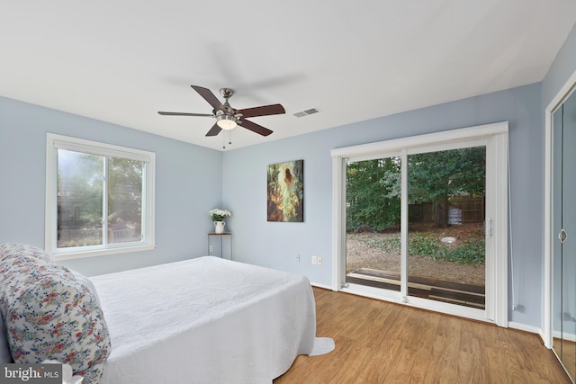 bedroom with access to outside, ceiling fan, and light hardwood / wood-style flooring