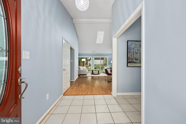 entrance foyer featuring light hardwood / wood-style floors and a chandelier