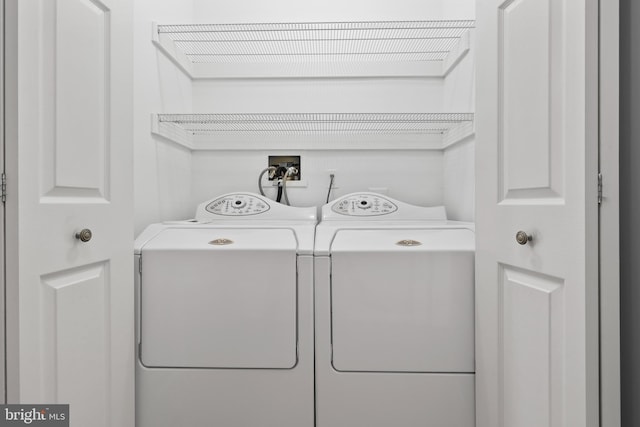 washroom featuring independent washer and dryer