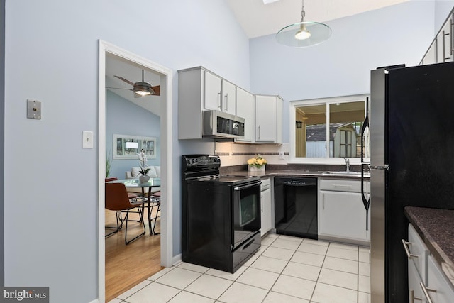 kitchen with ceiling fan, white cabinets, sink, decorative light fixtures, and black appliances