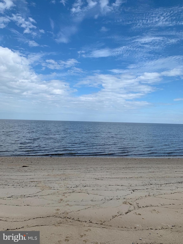 property view of water featuring a beach view