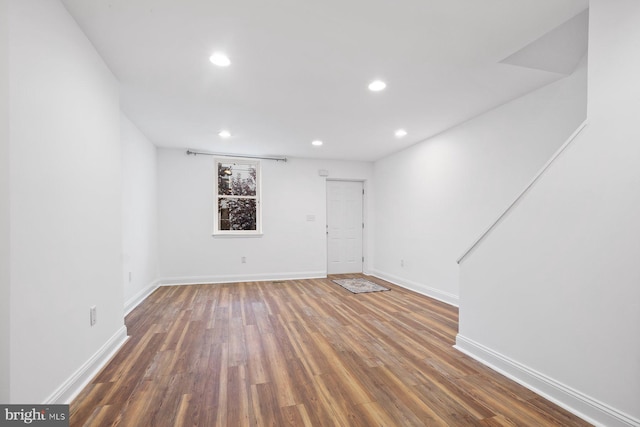 spare room with dark wood-type flooring