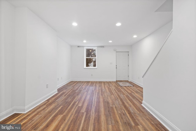 unfurnished room with dark hardwood / wood-style floors