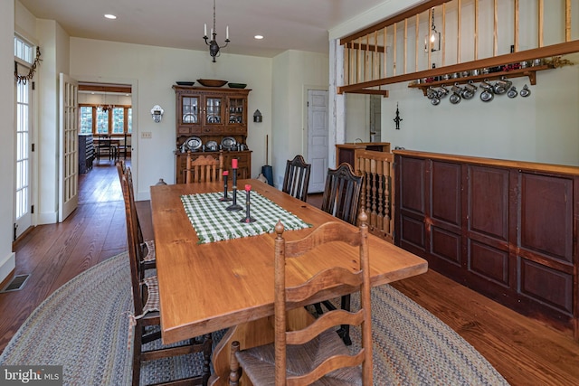 dining room with dark hardwood / wood-style floors