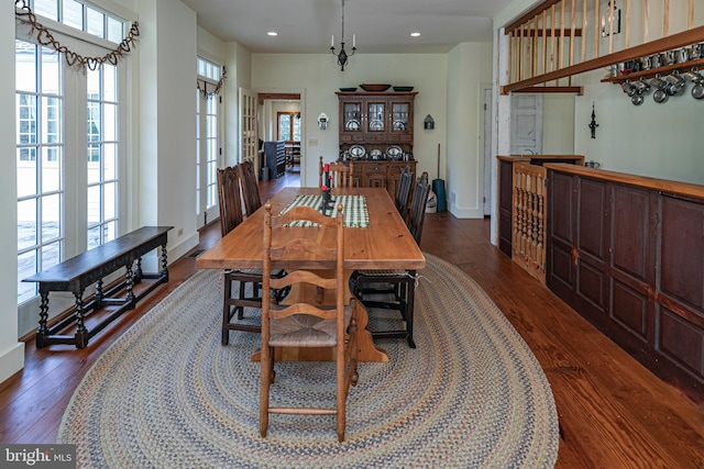 dining area featuring dark wood-type flooring and french doors