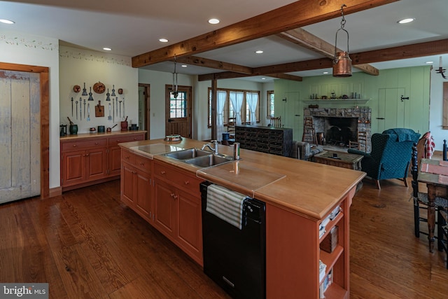 kitchen featuring sink, dishwasher, an island with sink, dark hardwood / wood-style flooring, and beam ceiling