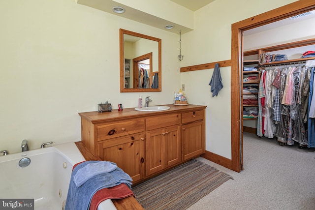 bathroom featuring vanity and a bathing tub