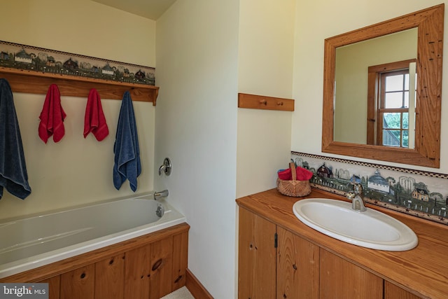 bathroom with vanity and a tub to relax in