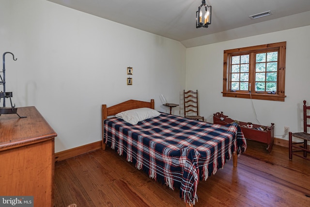 bedroom featuring dark wood-type flooring