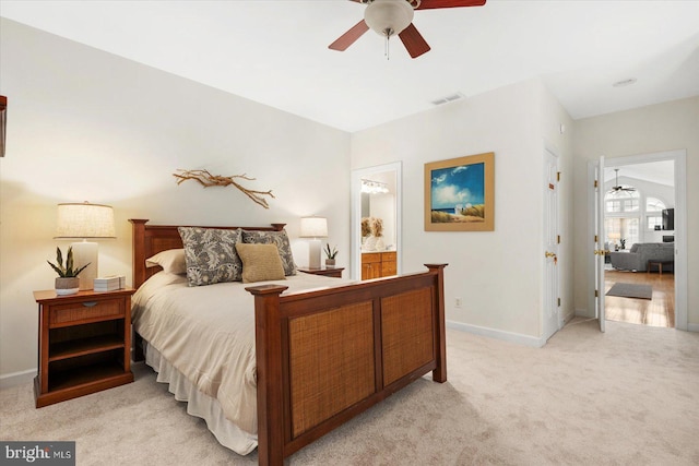 carpeted bedroom featuring ceiling fan and connected bathroom