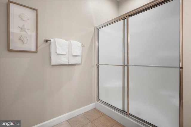 bathroom featuring tile patterned floors and walk in shower