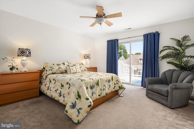 bedroom featuring access to exterior, ceiling fan, and carpet