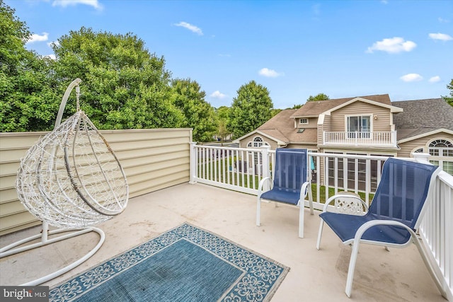 view of patio featuring a balcony