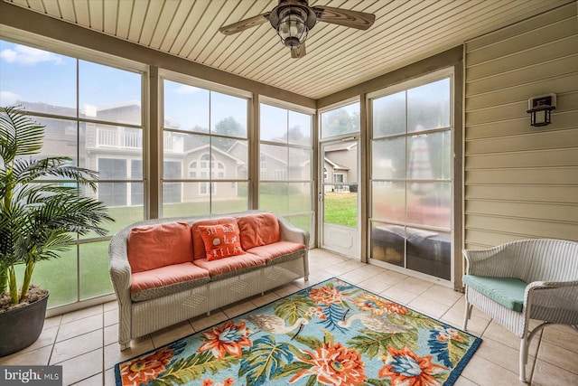 sunroom / solarium with wood ceiling and ceiling fan