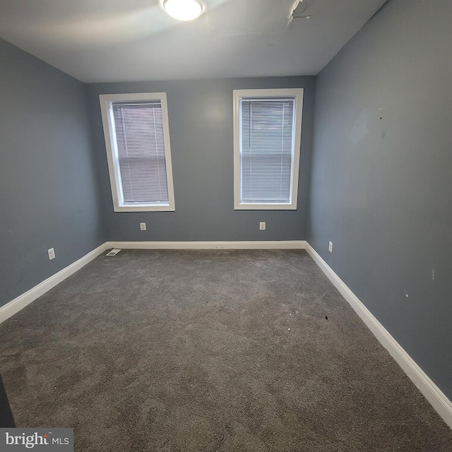 unfurnished room with carpet flooring