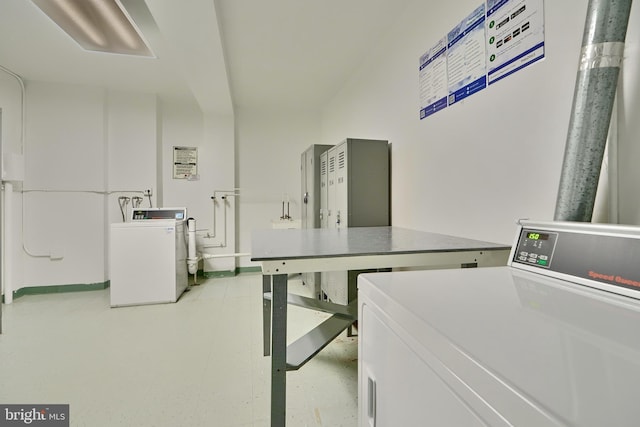 clothes washing area with independent washer and dryer