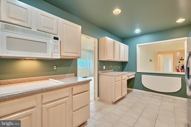 kitchen featuring light tile patterned flooring