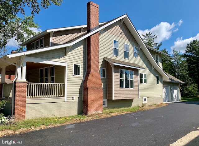 view of property exterior featuring a garage