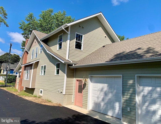 exterior space with a garage