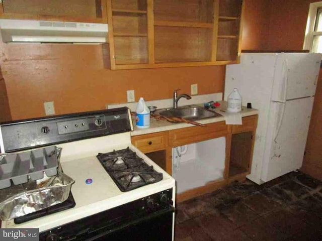 kitchen featuring white appliances and sink