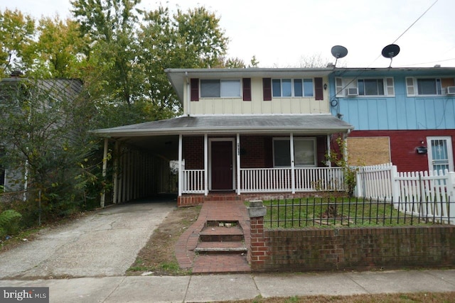 view of front facade featuring a carport and a porch