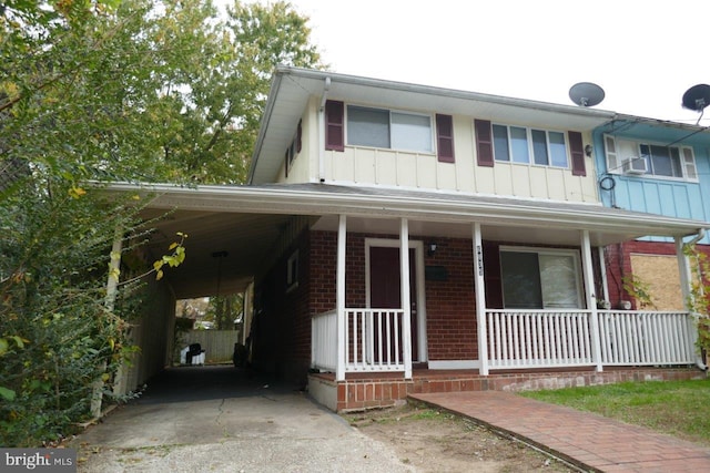 view of front facade featuring a carport and covered porch