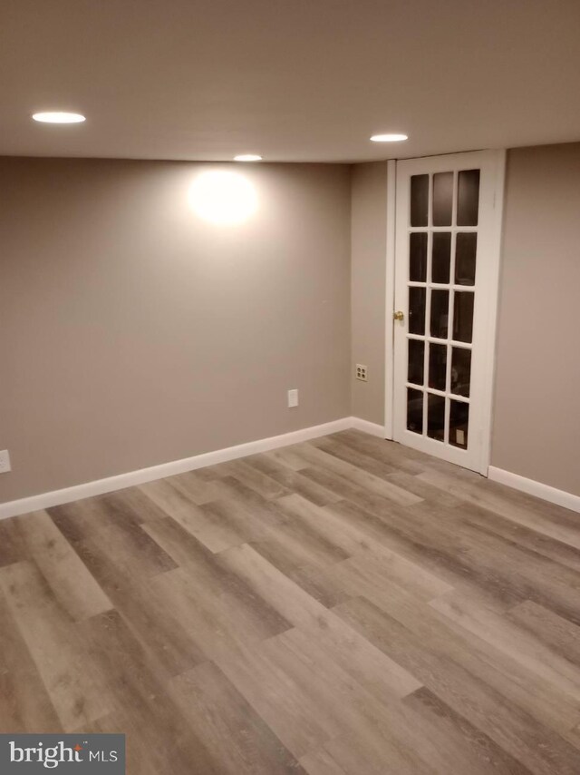 unfurnished room with wood-type flooring