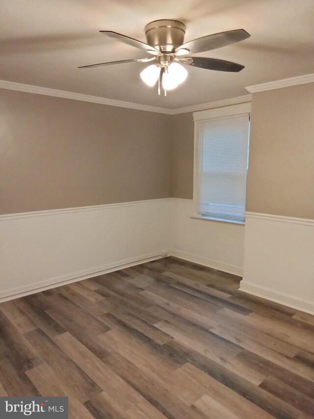 unfurnished room featuring crown molding, dark wood-type flooring, and ceiling fan