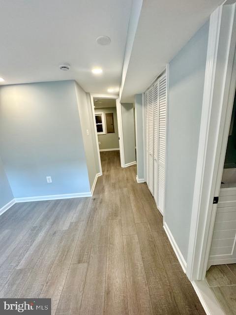 corridor featuring light hardwood / wood-style flooring