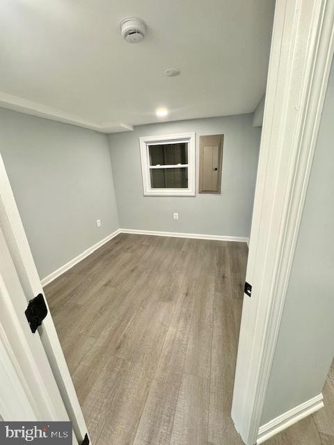 spare room with hardwood / wood-style floors