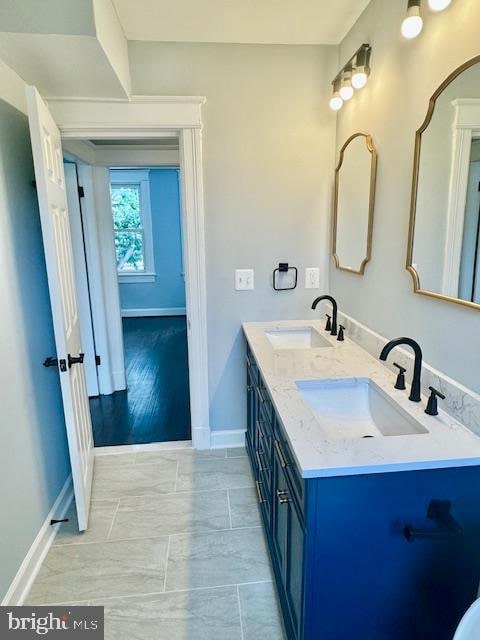 bathroom featuring vanity and hardwood / wood-style flooring