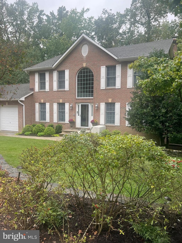 colonial-style house with a garage