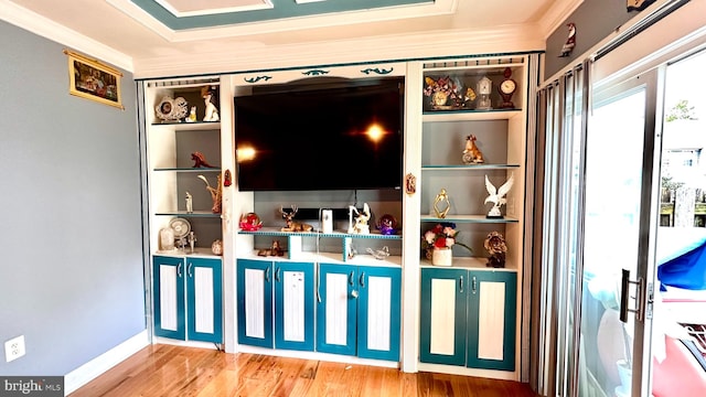 interior space featuring crown molding and hardwood / wood-style flooring