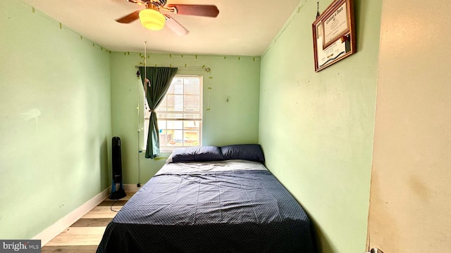 bedroom featuring ceiling fan and light hardwood / wood-style flooring