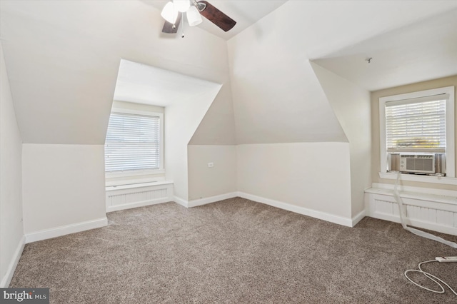 bonus room with carpet flooring and lofted ceiling