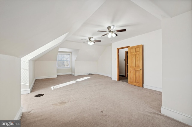 additional living space with lofted ceiling, ceiling fan, and carpet floors