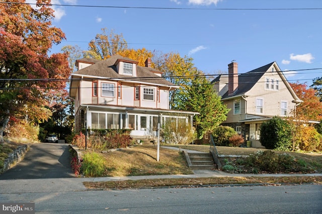 front of property featuring a sunroom