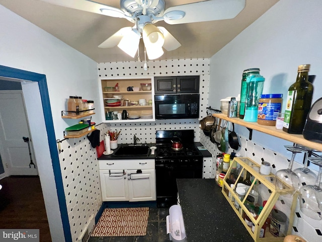 kitchen with sink, black appliances, white cabinetry, and ceiling fan