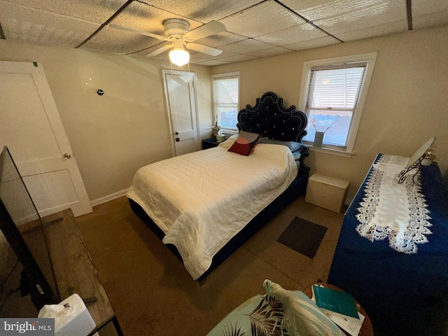 bedroom featuring a paneled ceiling and ceiling fan