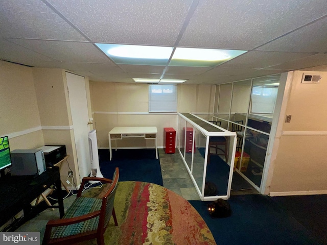 basement with a drop ceiling