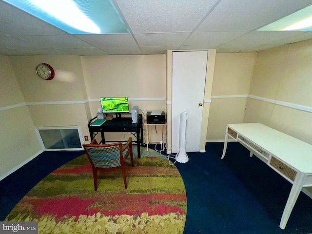 recreation room with carpet flooring and a drop ceiling